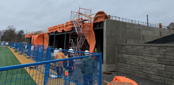 Construction crews work on the Lang Pavilion.