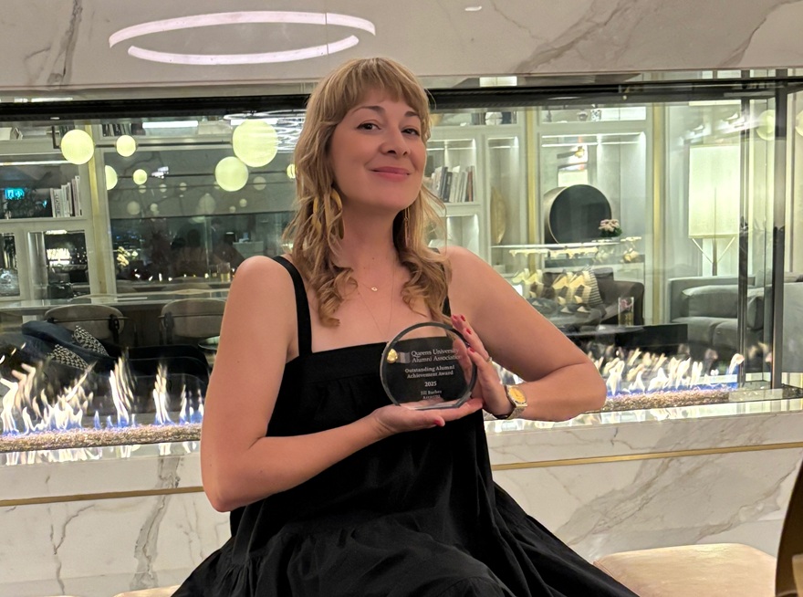 Jill Barber proudly holding up her award at the QUAA Gala.