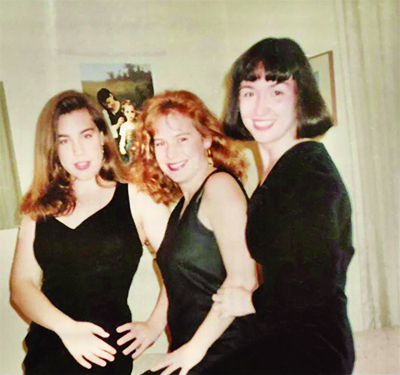 Karen Betrand, centre, poses for picture as Queen's Artsci student