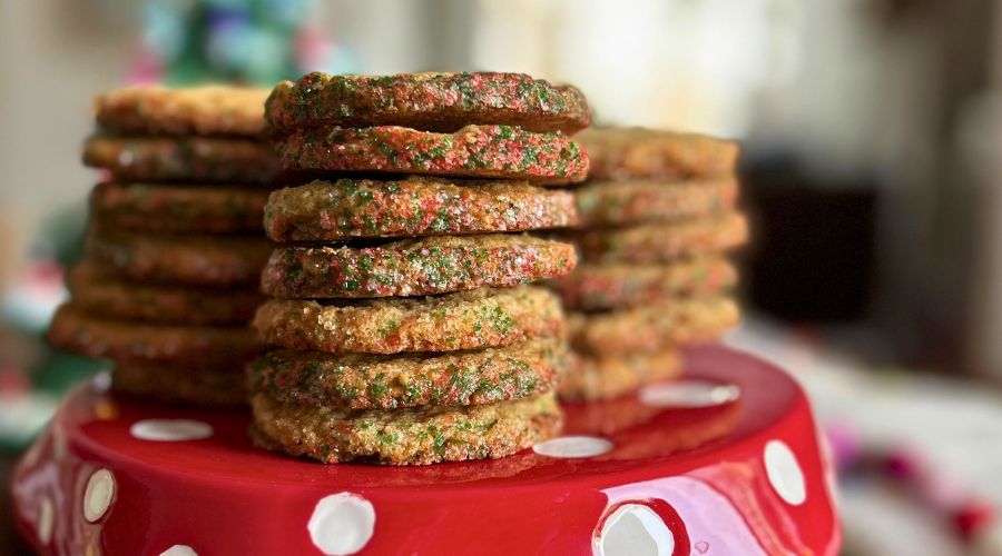 A stack of Nanna’s Ice Box Cookies arranged on a vibrant red plate, showcasing their delicious texture and appearance.