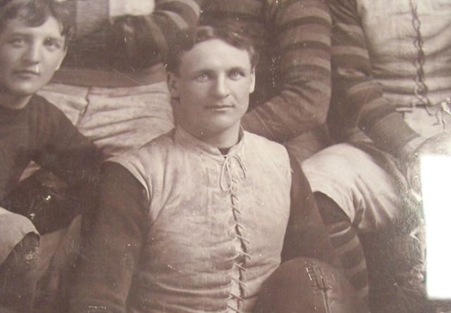Guy Curtis holding a football