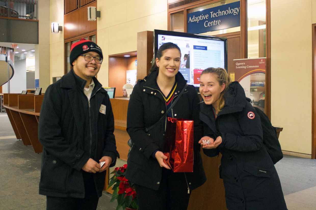 Alumni deliver candy to students during exams