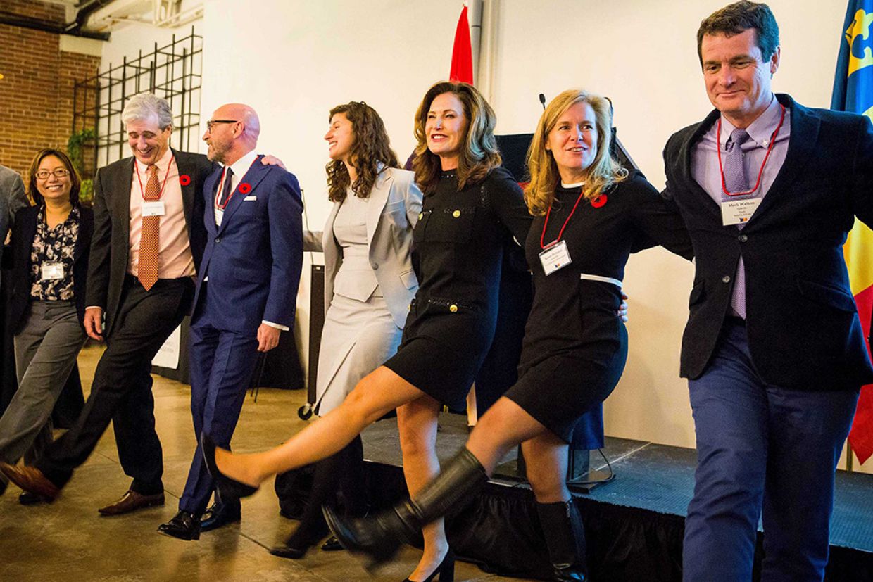 Alumni doing an Oil Thigh at the Johnson Award reception