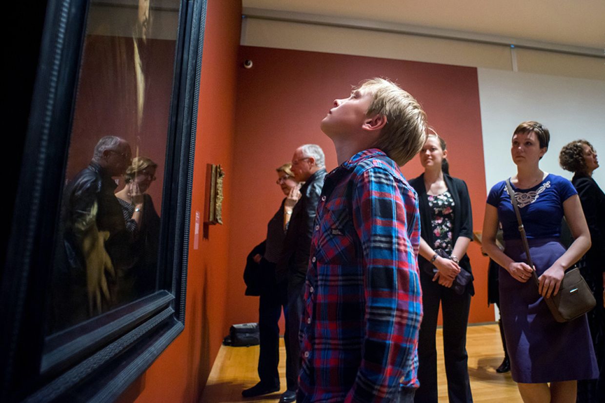 Young boy looking up at painting in the Agnes Etherington Art Gallery