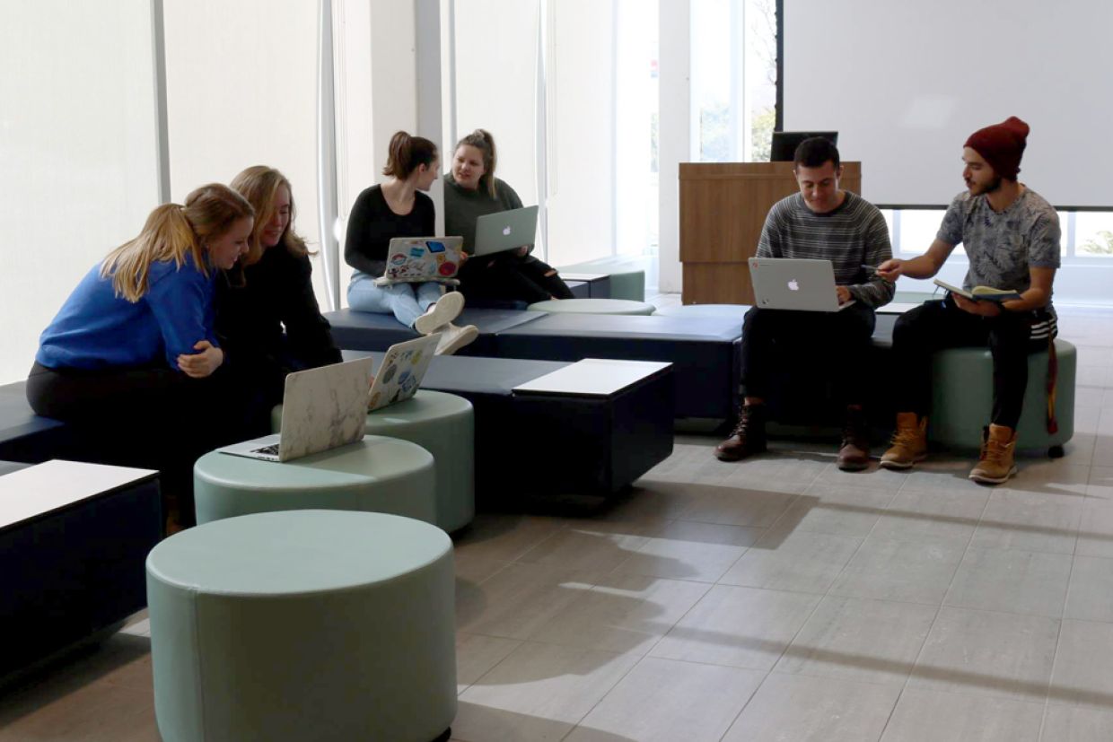 Queen's students working in Mitchell Hall. 