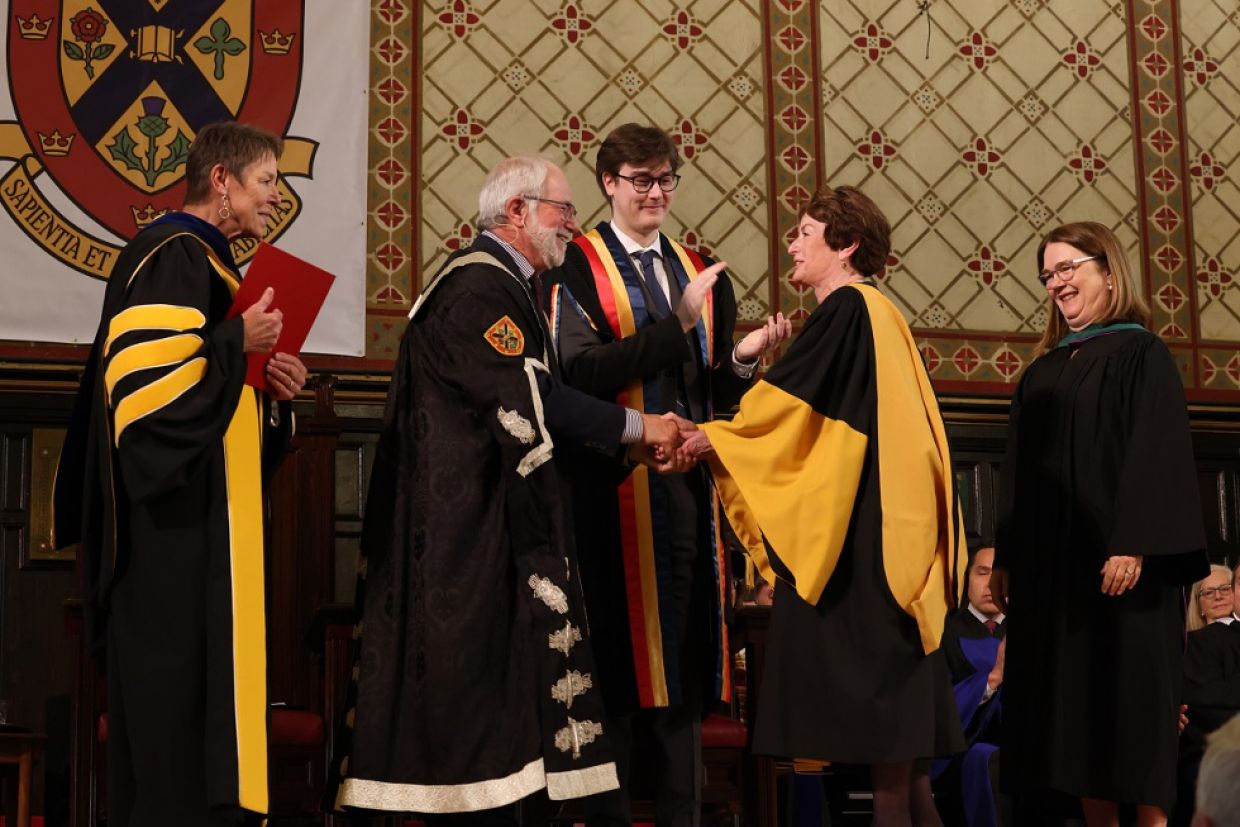 Elizabeth Eisenhauer on stage receiving her honorary degree.