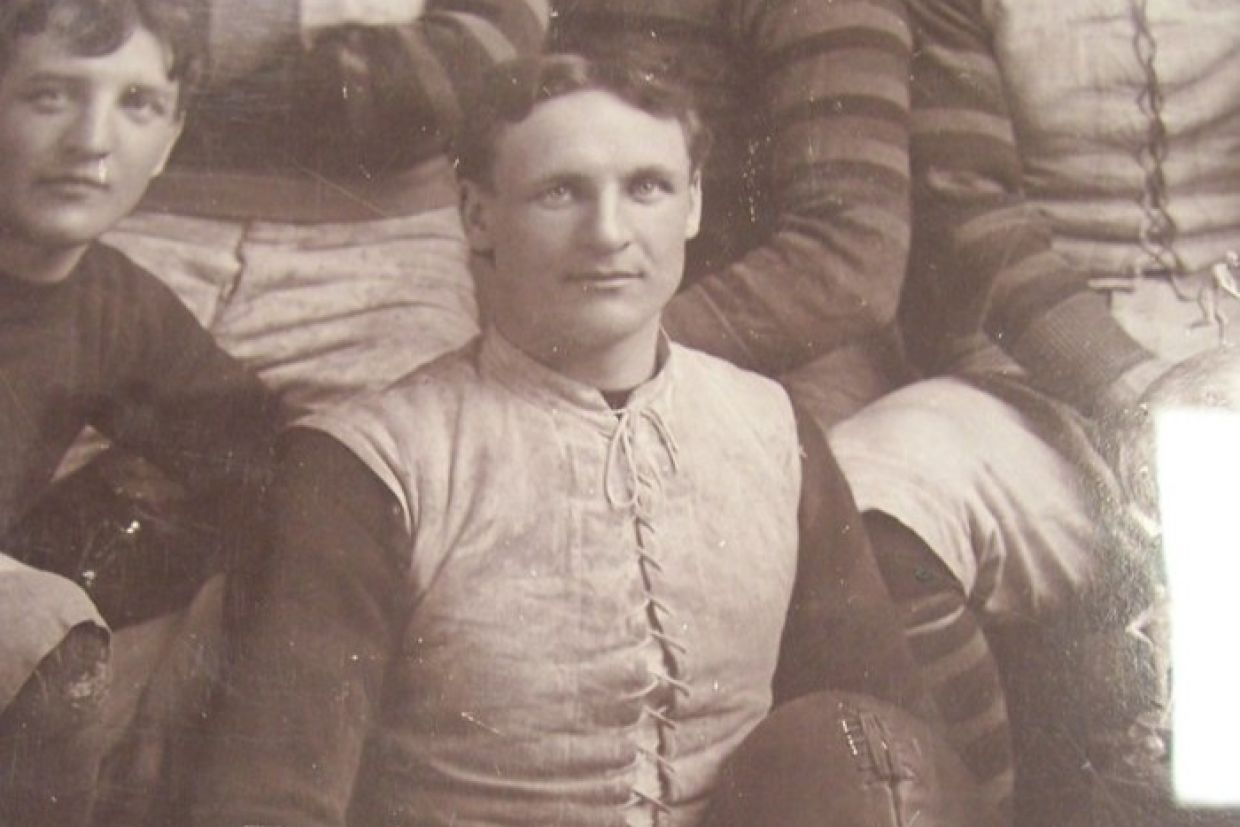 Guy Curtis holding a football
