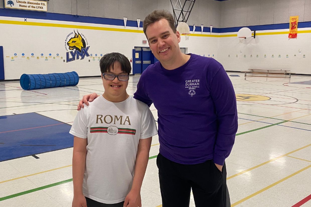 Artsci’15 alumnus Justin Heenan with a student