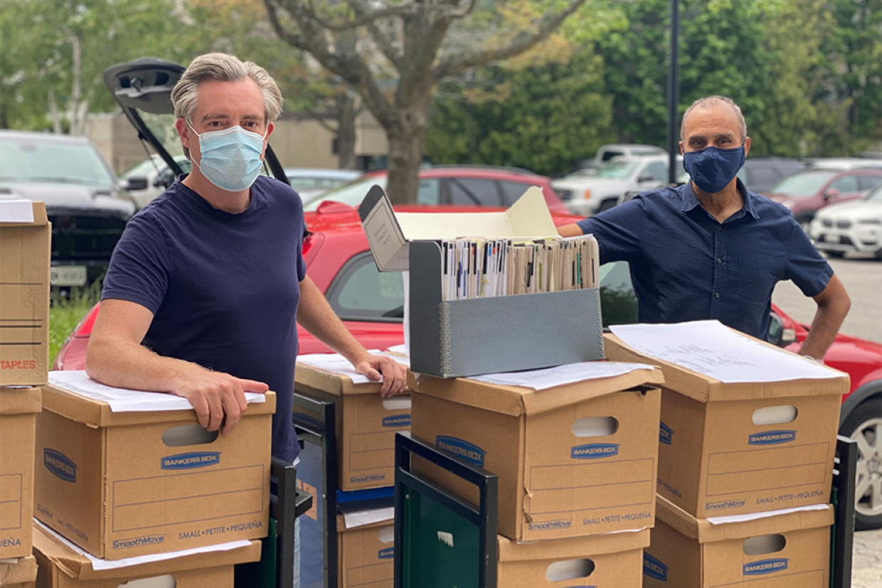 Peter MacLeod, MA’02, with Dr. Jonathan Rose, MA’89, PhD’93, standing with the archival donation.