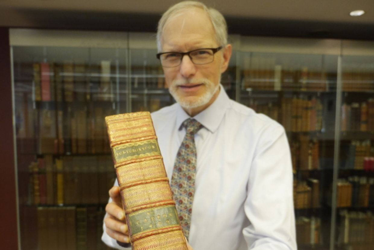 Alvan Bregman holding the Caxton