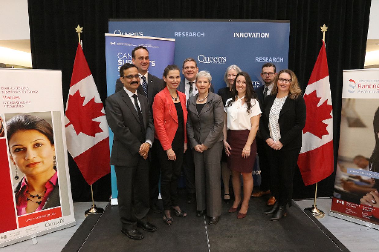 Group photo of politicians, administrators, and researchers.