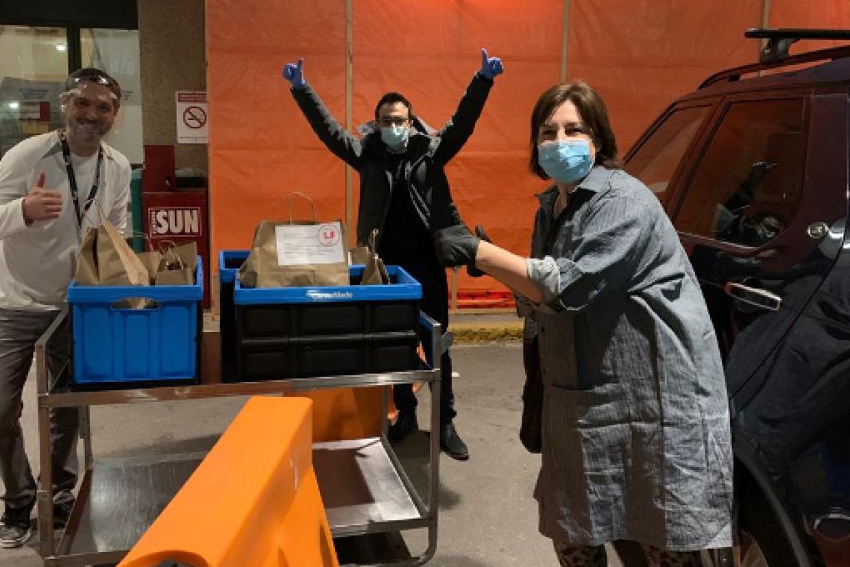 A photo of Adair Roberts making a delivery to health-care workers 