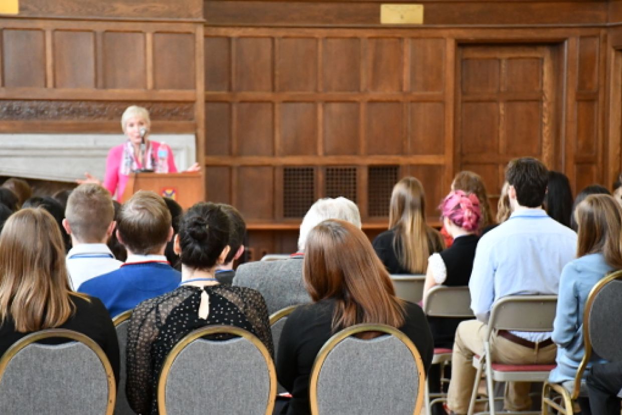 Students listening to speaker at event 