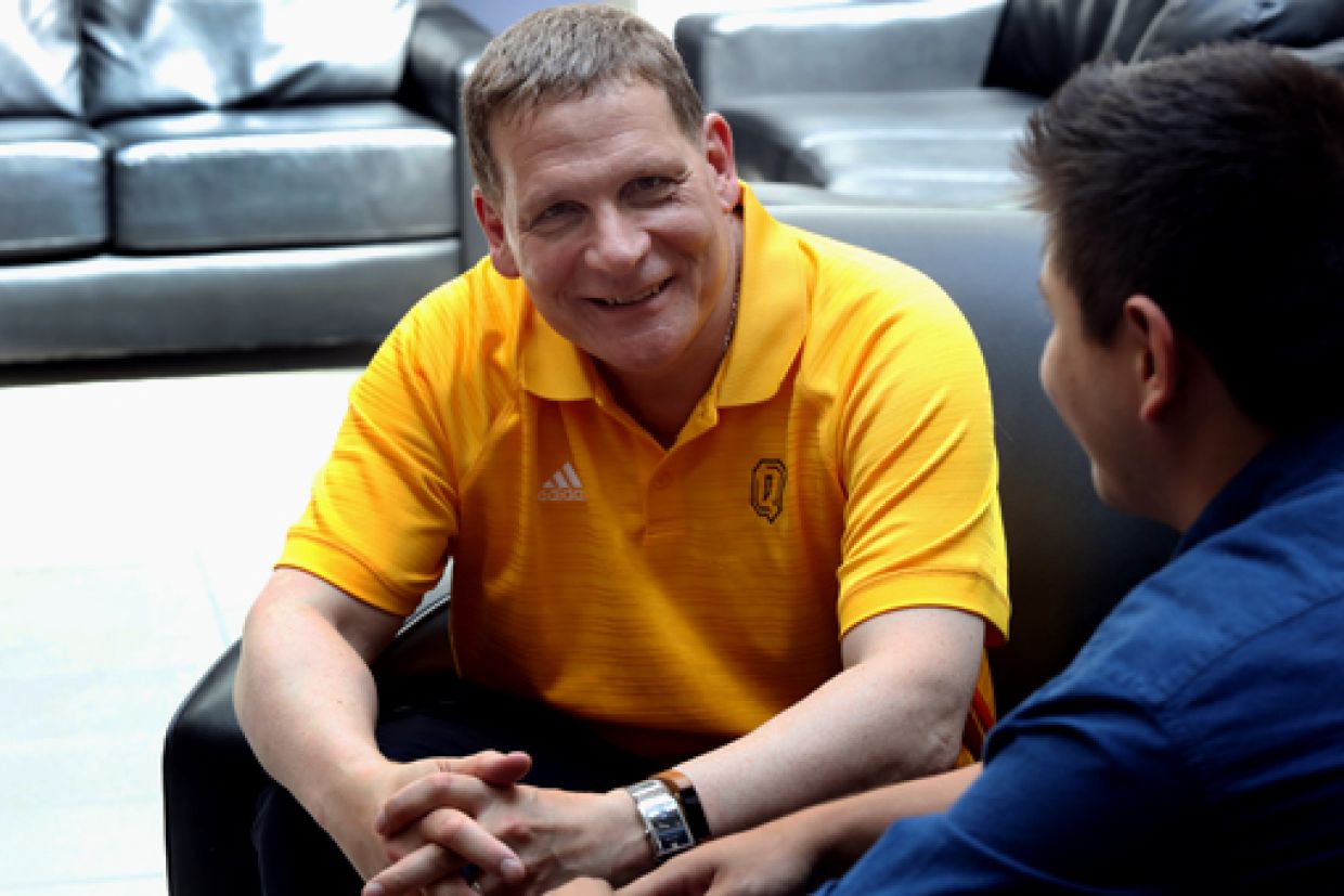 principal woolf speaking with student