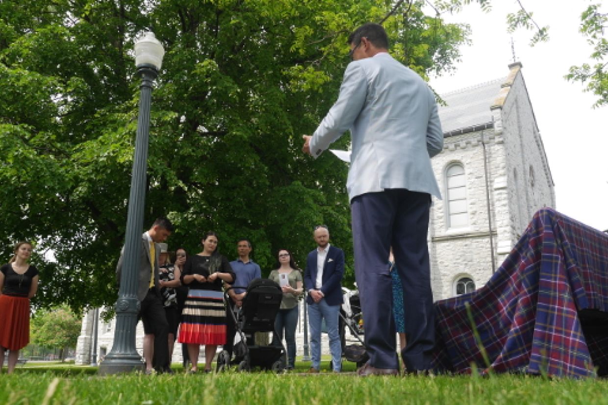 Brian Toda speaks during ceremony