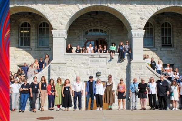 photo of a group of people gathered around an outdoor staircase 