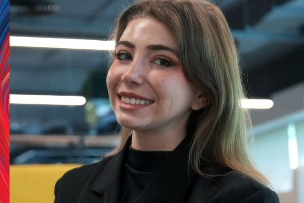 Ally Zlatar smiling wearing black shirt and has long brown hair
