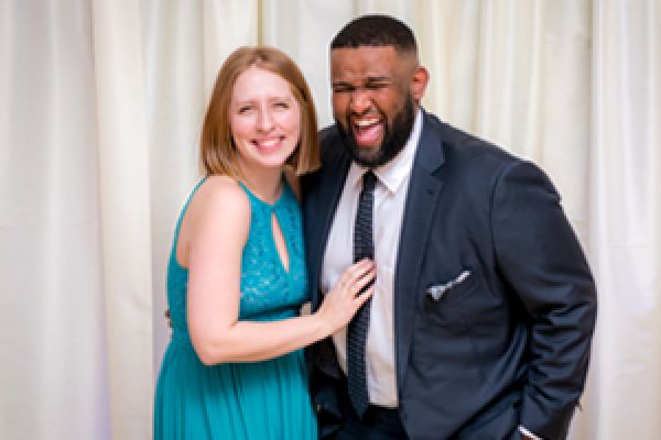 Two attendees at the Alumni Awards Gala having their photo taken.