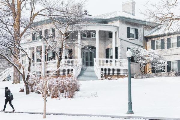 Summerhill building during the winter with trees next to the building. 