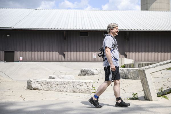 Senior Research and Development Engineer Michael Shepertycky, Sc’11, MASc’13, PhD’21, wearing one of his patented exoskeletons.