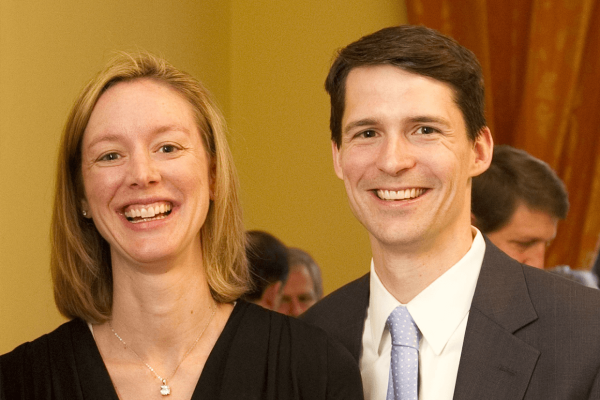 Adrienne and Ted Goldthorpe, BCom'99 smiling and wearing formal attire.