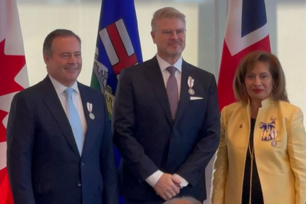 Alumnus David Weyant, middle, with then-Premier Jason Kenney, left, and Lt.-Gov. Salma Lakhani.
