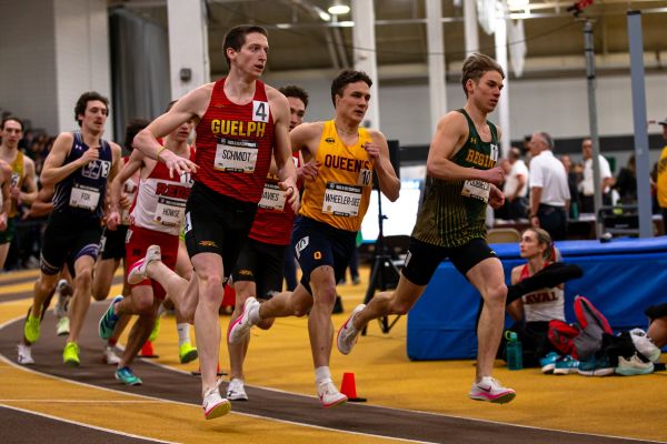 Jude Wheeler-Dee running in an indoor race at the University of  Manitoba. 