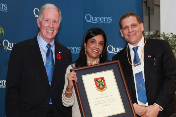 Chancellor Leech and Principal Woolf present a 2015 DSA to recipient Arunima Khanna last year.