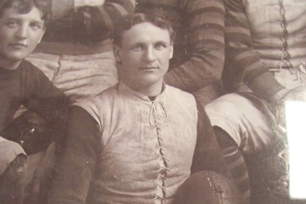 Guy Curtis holding a football. 