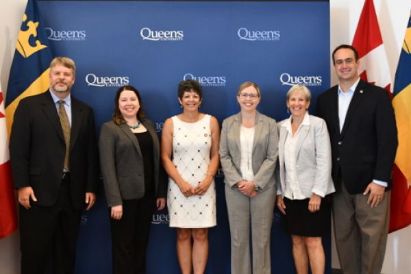 Speakers at the podium during the announcement