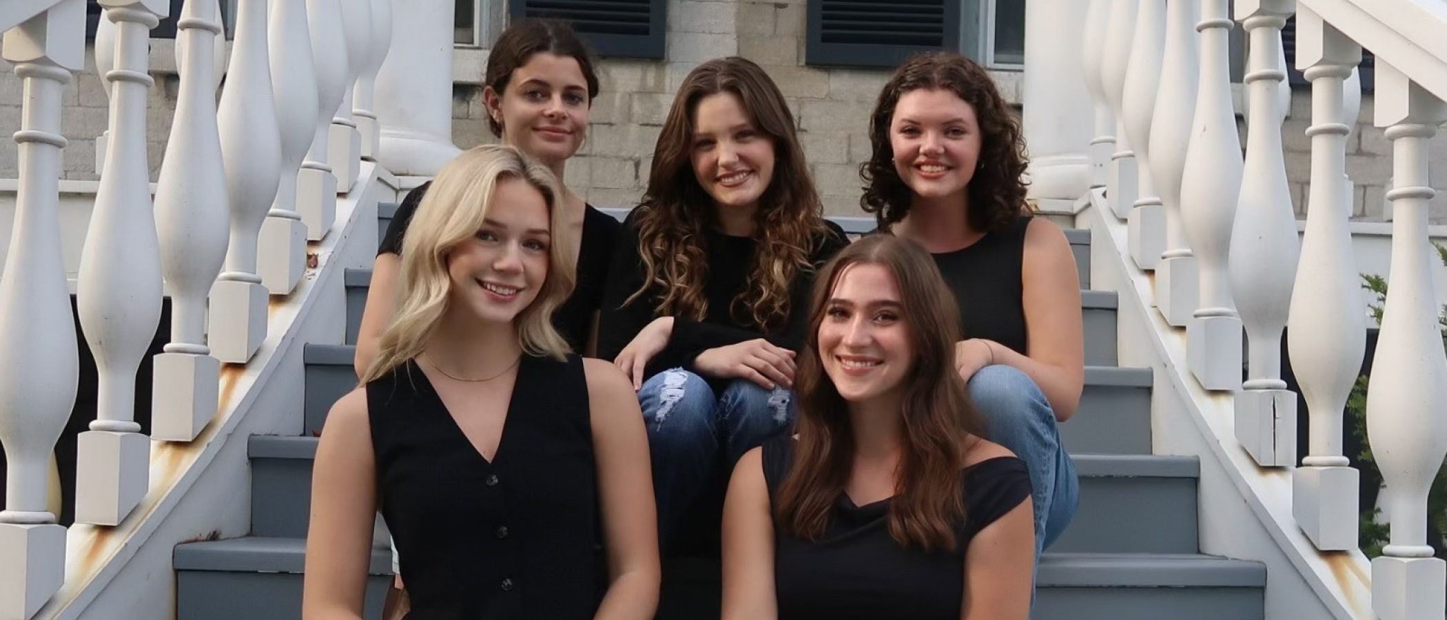 photo of students sitting in chairs