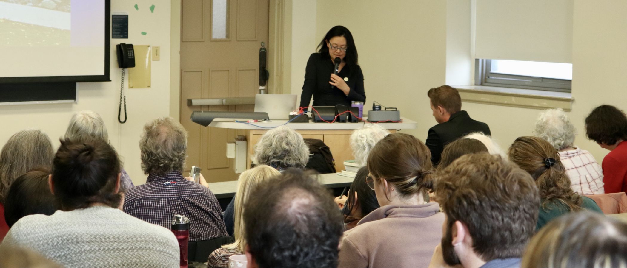 Rita Wong talking into a microphone 