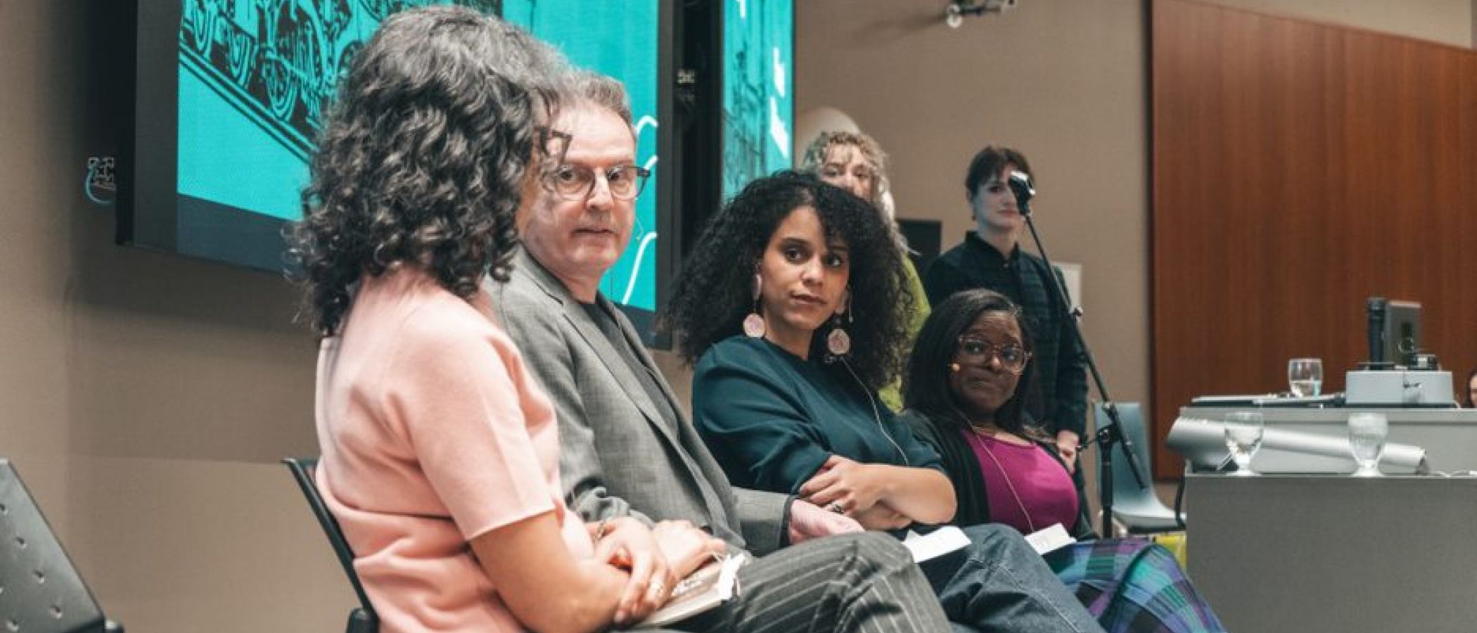 people sitting in front of projector
