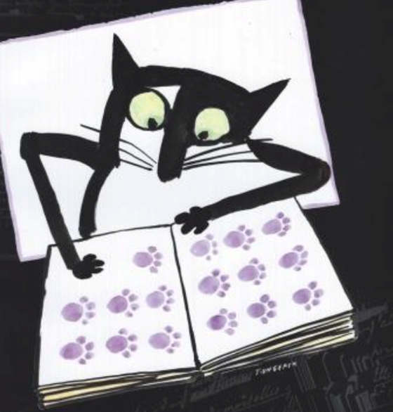 A black and white cat making paw prints in a book