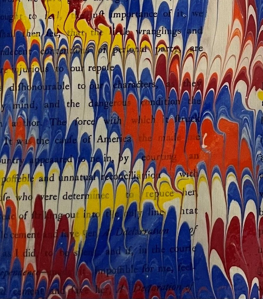 Page of a book covered in paint