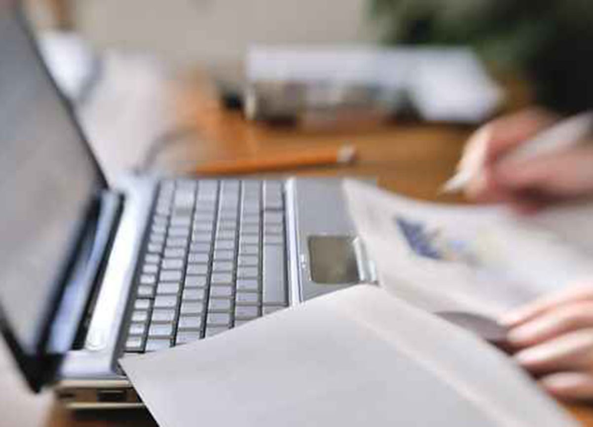hands typing on a keyboard 
