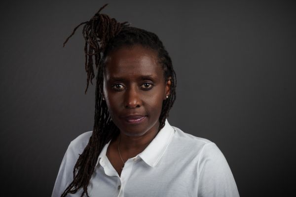 photo of Juliane in a white button down collared shirt