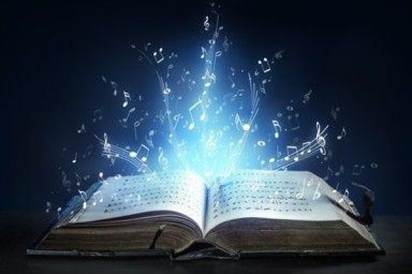 Open book with blue sparkles coming out of it 