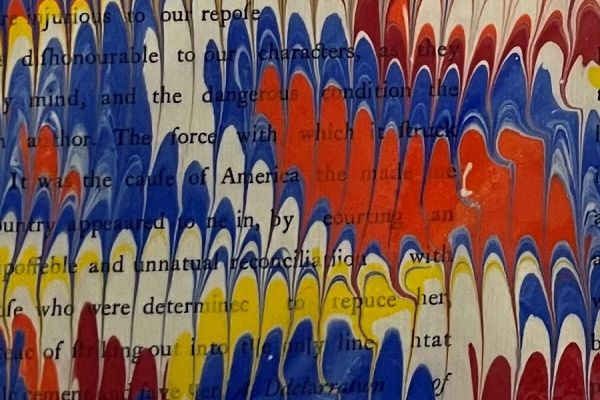 Page of a book covered in paint