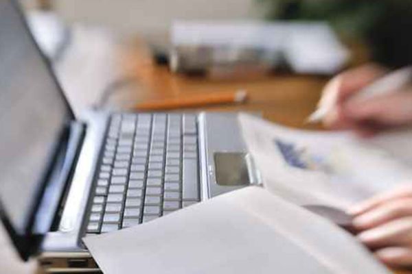 hands typing on a keyboard 