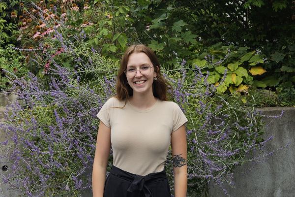 photo of student standing in front of lavender bush