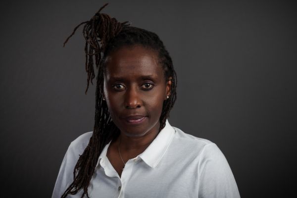 photo of Juliane in a white button down collared shirt