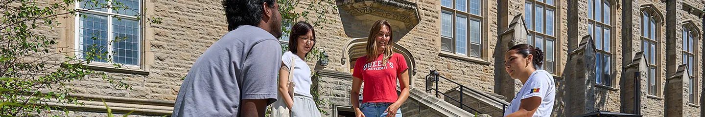 Photo of a group of Queen's students chatting outside JDUC