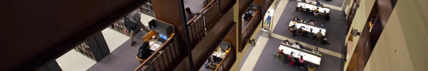 Photo of a view of Stauffer Library indoors from upper level