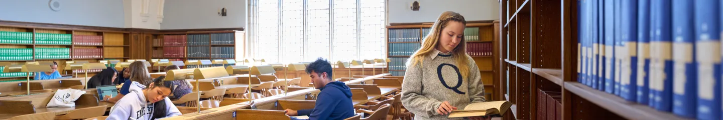 A photo of group of Queen's students reading in the library