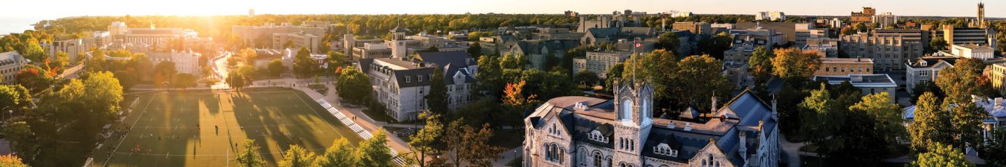A photo overlooking Queen's University campus at sunset