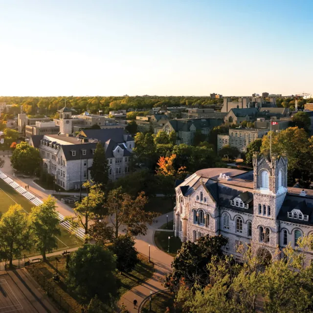 A photo overlooking Queen's University campus at sunset