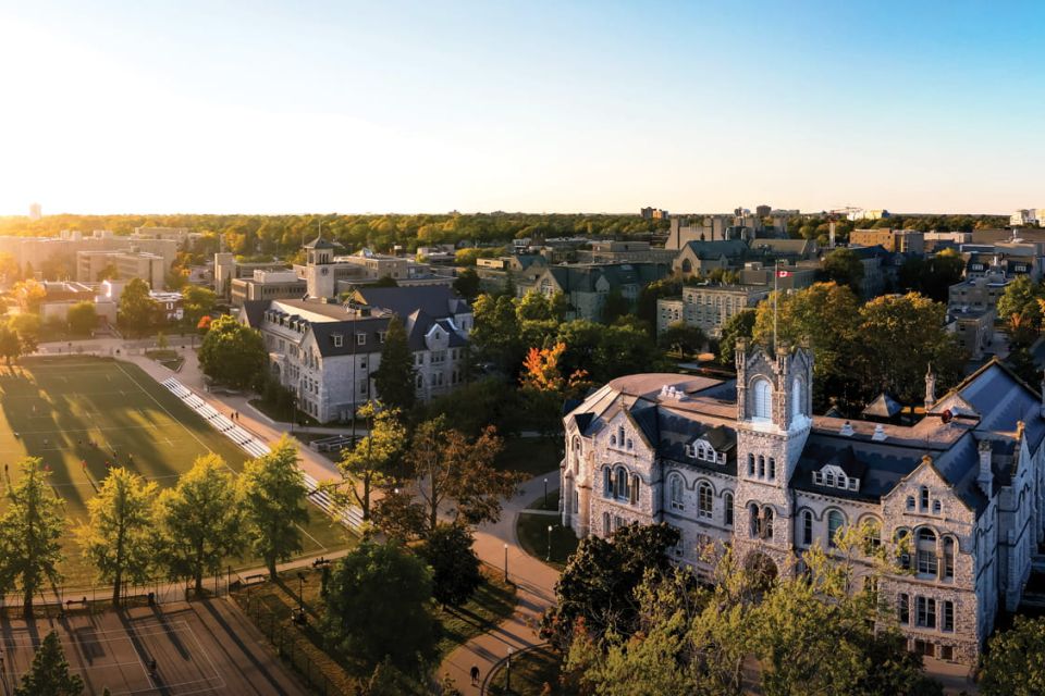 A photo overlooking Queen's University campus at sunset