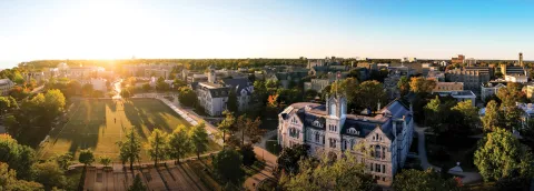 A photo overlooking Queen's University campus at sunset